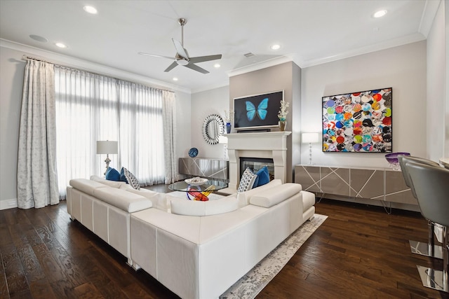 living room with ceiling fan, dark wood-type flooring, and crown molding