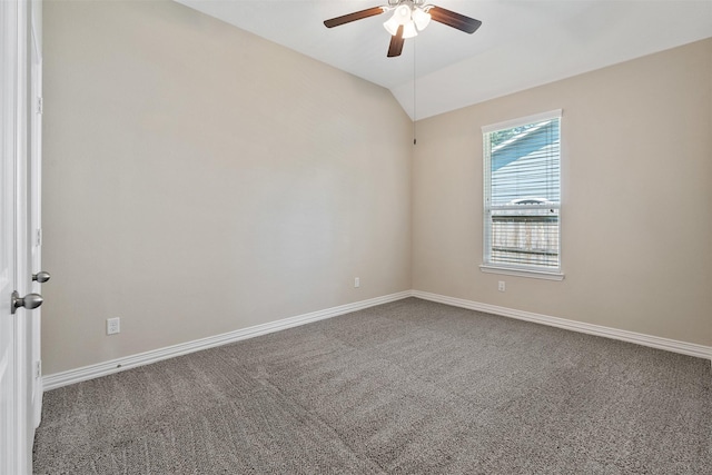 carpeted empty room with ceiling fan and lofted ceiling