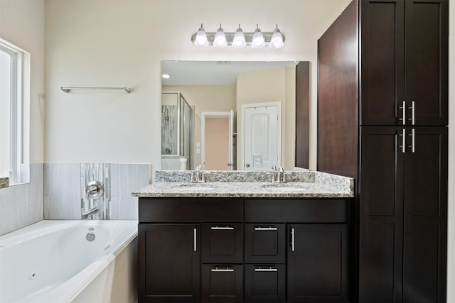 bathroom with shower with separate bathtub and vanity