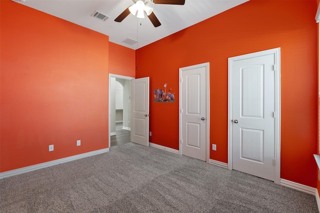 unfurnished bedroom with carpet flooring and ceiling fan