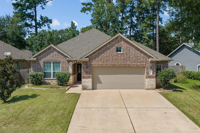 view of front of home featuring a garage and a front lawn