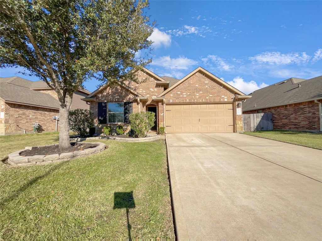 view of front of property with a front lawn and a garage