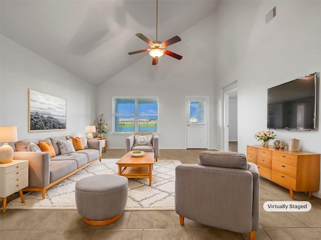 living room featuring ceiling fan, high vaulted ceiling, and light tile patterned floors