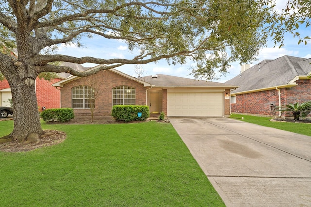 ranch-style house featuring a garage and a front lawn