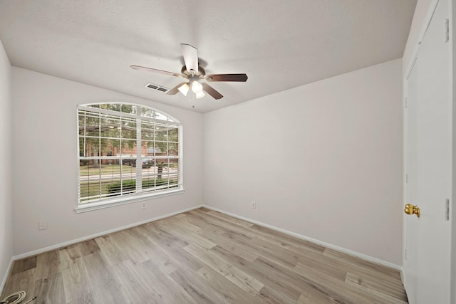 spare room with light hardwood / wood-style flooring