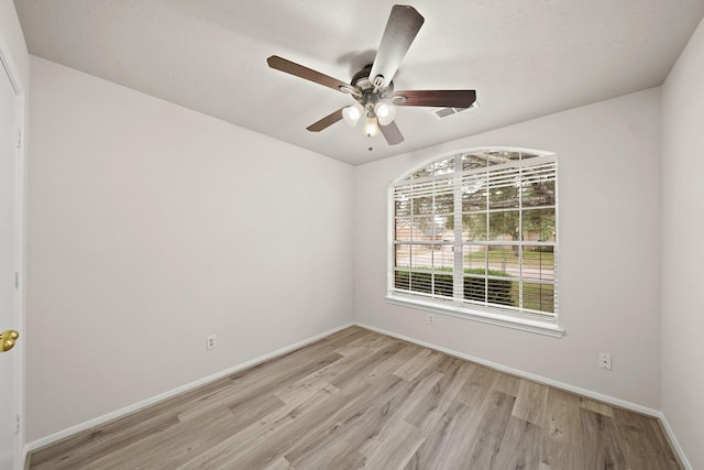 unfurnished room featuring light hardwood / wood-style floors and ceiling fan