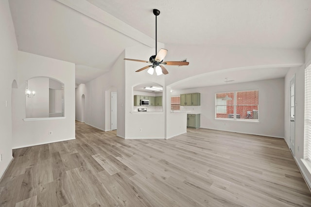 unfurnished living room with ceiling fan, light hardwood / wood-style floors, and vaulted ceiling with beams