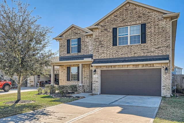 view of front of house with a garage and a front lawn