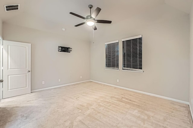 unfurnished room featuring ceiling fan, light carpet, and lofted ceiling