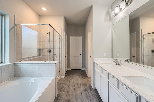 bathroom featuring vanity and shower with separate bathtub