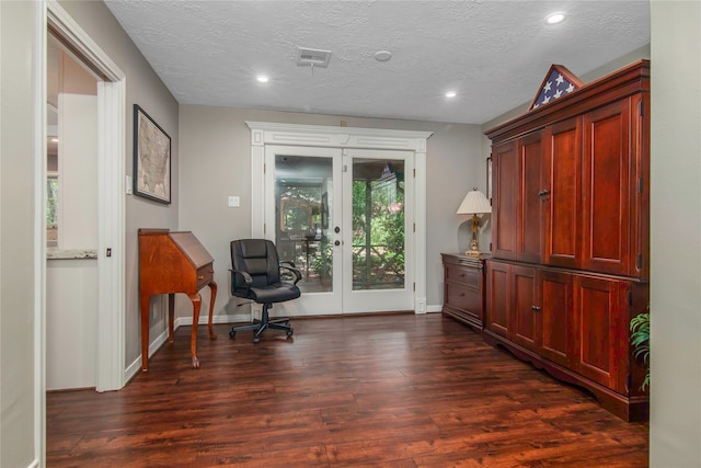 office with a textured ceiling, french doors, and dark hardwood / wood-style floors