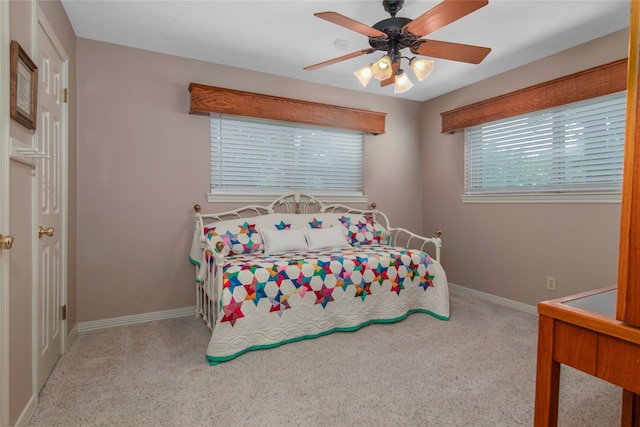 carpeted bedroom with ceiling fan