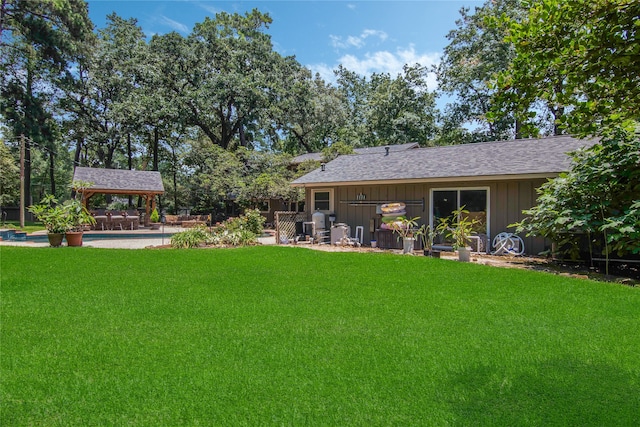 view of yard featuring a gazebo and a swimming pool