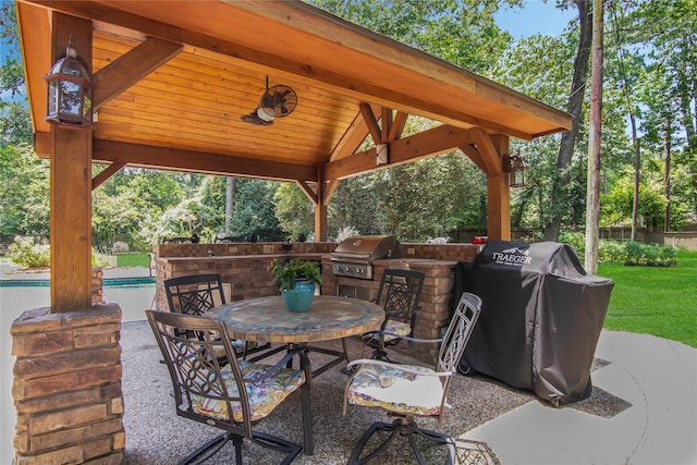 view of patio / terrace with a gazebo, an outdoor kitchen, and grilling area