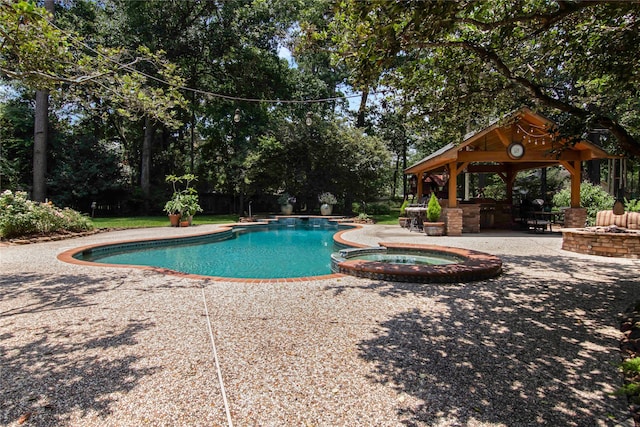 view of swimming pool with an in ground hot tub, a gazebo, and a patio area