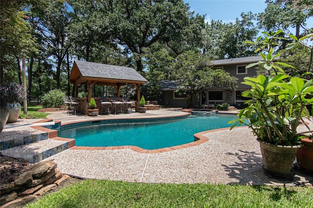 view of swimming pool with a gazebo and a patio area