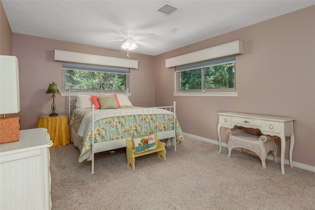 bedroom featuring ceiling fan and light colored carpet