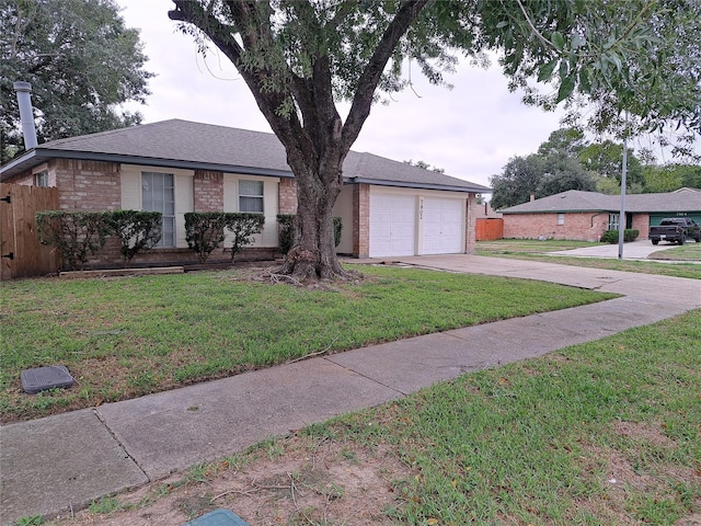 single story home featuring a garage and a front yard