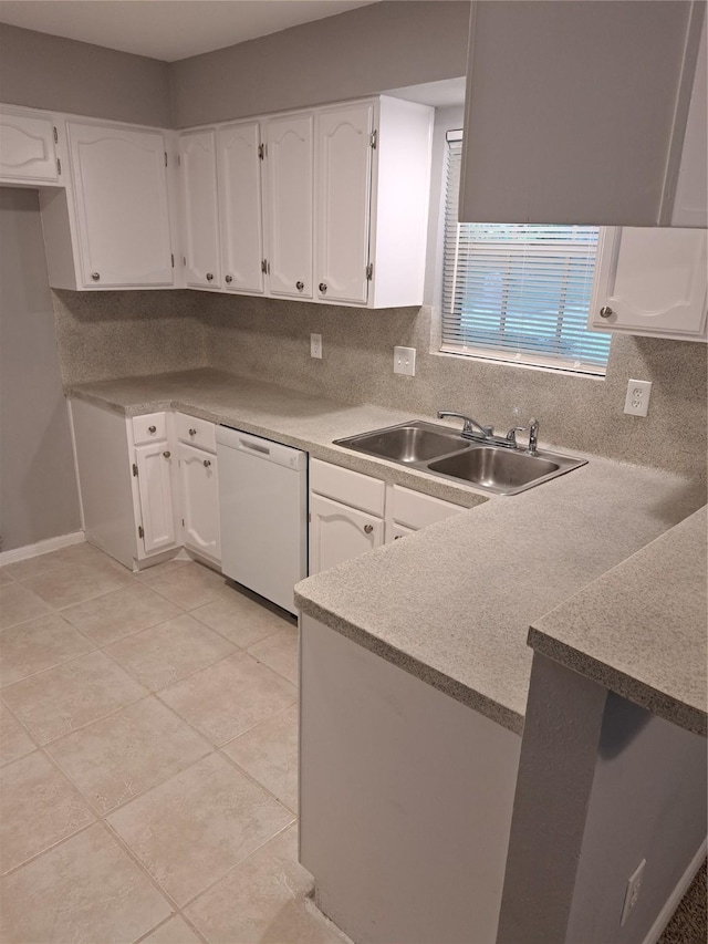 kitchen featuring dishwasher, sink, light tile patterned floors, decorative backsplash, and white cabinets