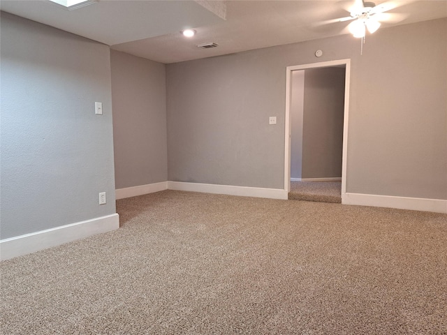 spare room featuring carpet and ceiling fan