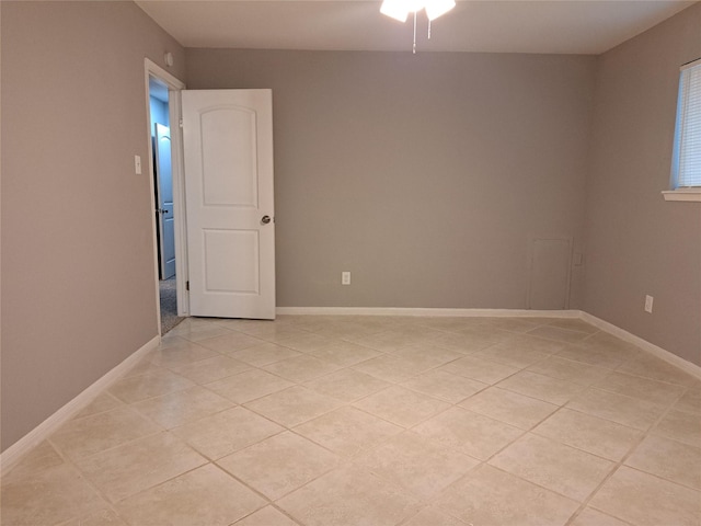 empty room with light tile patterned flooring