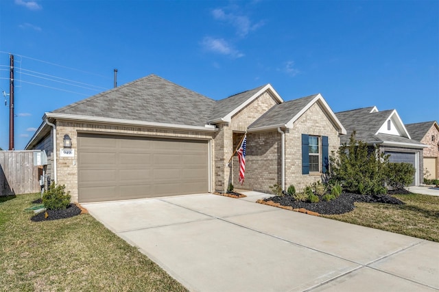 ranch-style house featuring a front yard and a garage