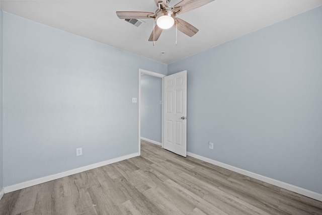 unfurnished room with ceiling fan and light wood-type flooring