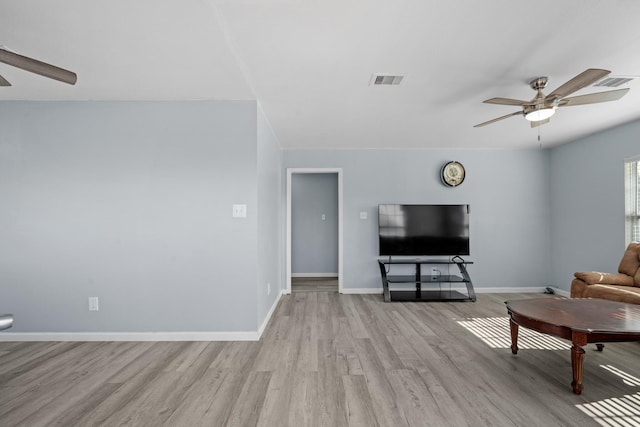 living room featuring light wood-type flooring and ceiling fan