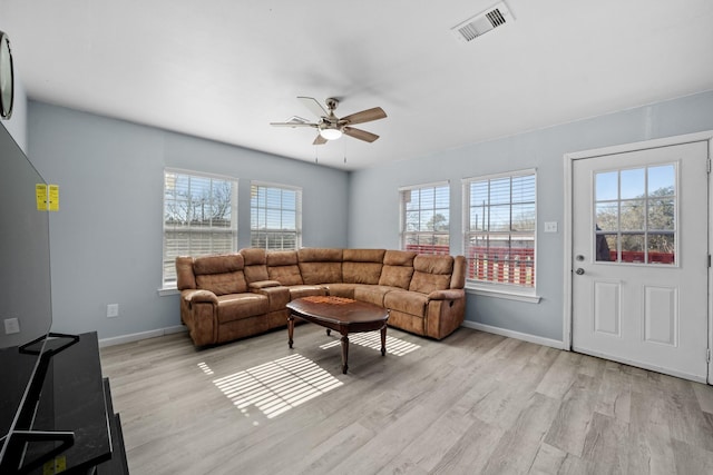 living room with ceiling fan and light wood-type flooring