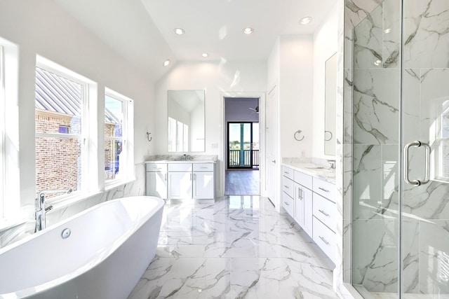 bathroom with vanity, lofted ceiling, and shower with separate bathtub