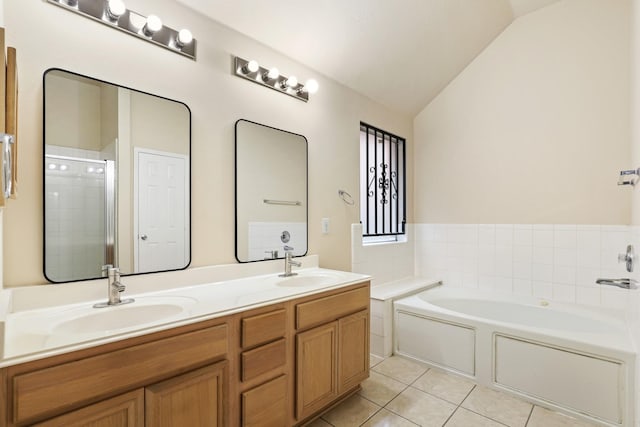 bathroom with vanity, lofted ceiling, tile patterned floors, and shower with separate bathtub