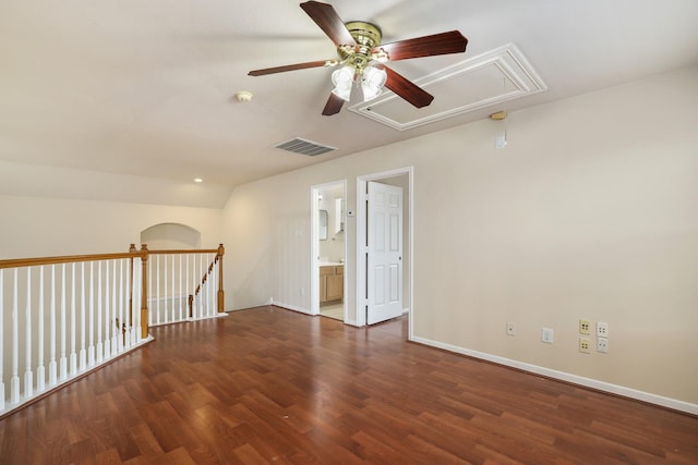 empty room featuring ceiling fan and dark wood-type flooring