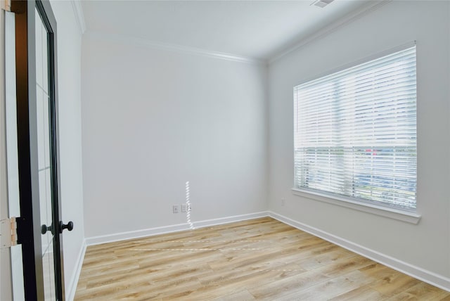 unfurnished room with light hardwood / wood-style floors and ornamental molding