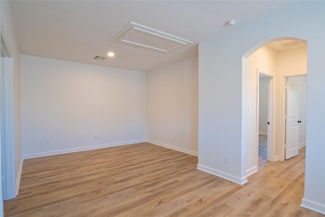 empty room with light hardwood / wood-style floors