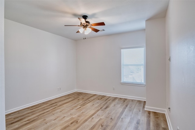 empty room with light wood-type flooring and ceiling fan