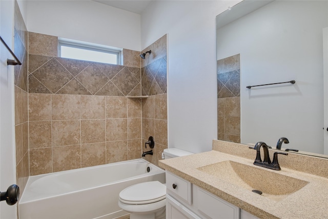 full bathroom featuring vanity, toilet, and tiled shower / bath