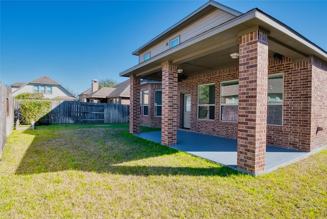 exterior space featuring a patio area and a yard