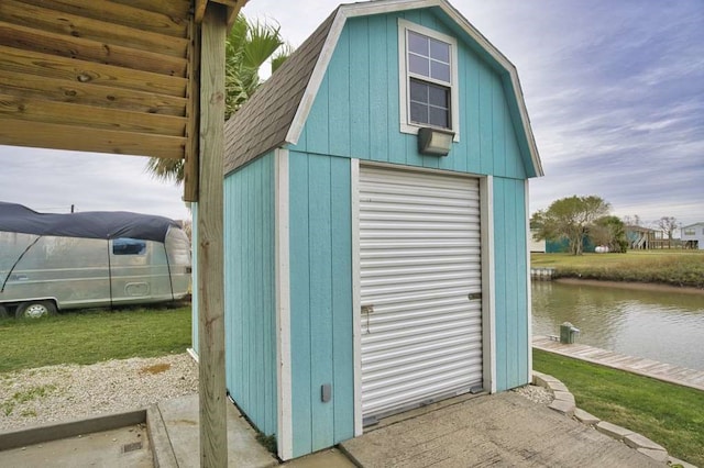 view of outbuilding featuring a water view