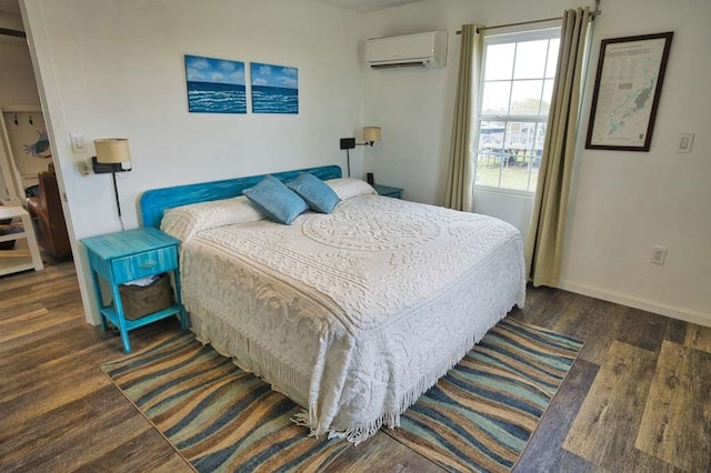 bedroom featuring dark wood-type flooring and a wall mounted air conditioner