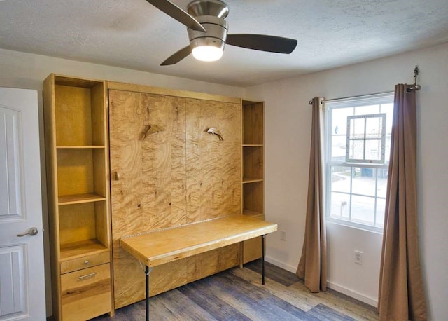 mudroom featuring ceiling fan, dark hardwood / wood-style floors, and a textured ceiling