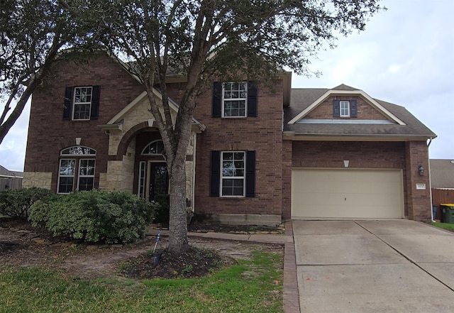 view of front of property with a garage