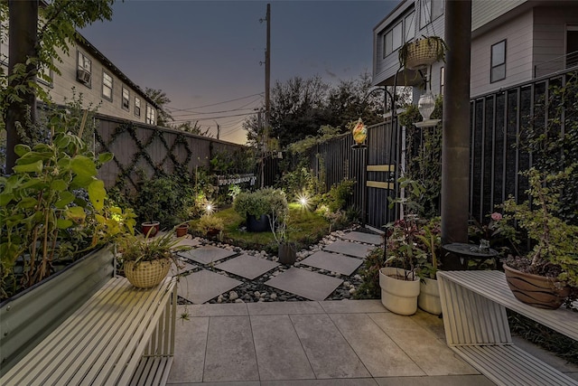 view of patio terrace at dusk