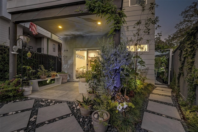 view of patio terrace at dusk