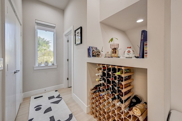 wine room with light hardwood / wood-style floors