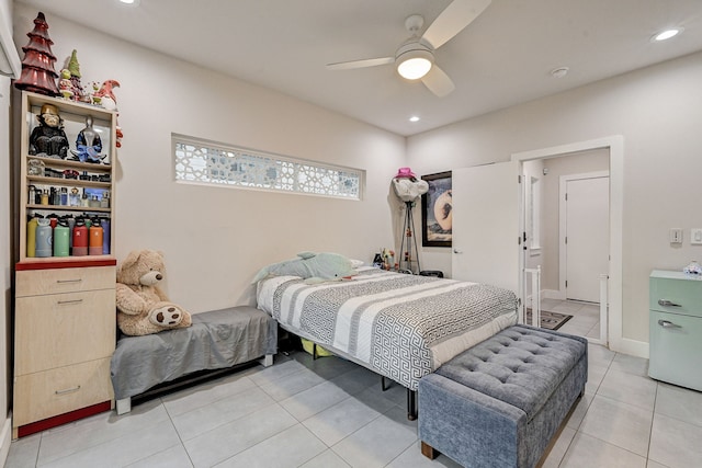 tiled bedroom featuring ceiling fan