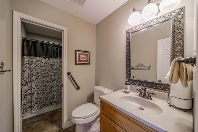 bathroom with toilet, vanity, and a shower with curtain