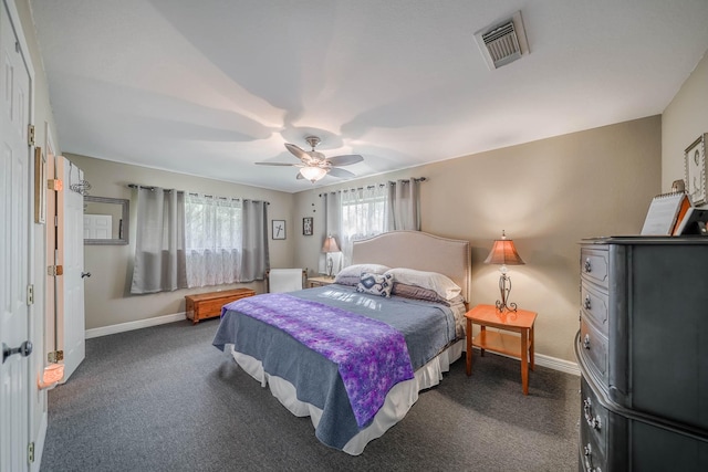 bedroom featuring ceiling fan and dark colored carpet