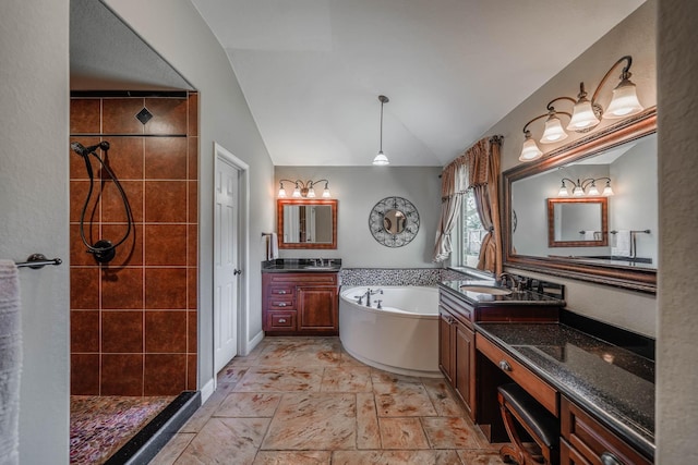 bathroom with vanity, vaulted ceiling, and plus walk in shower