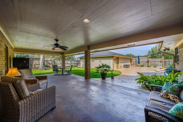 view of patio featuring ceiling fan and an outdoor living space