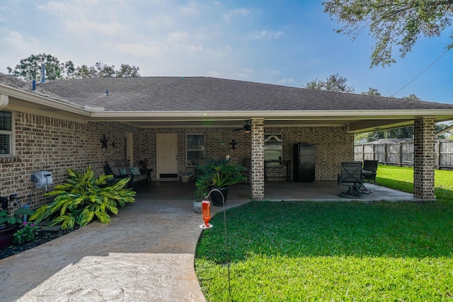 exterior space featuring a carport and a lawn